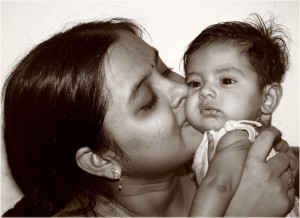 woman and baby by Asim Chauduri is licensed under CC by 2.0